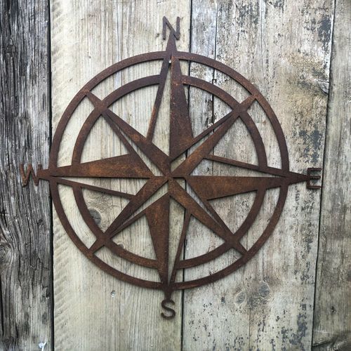 Rusty COMPASS Sign